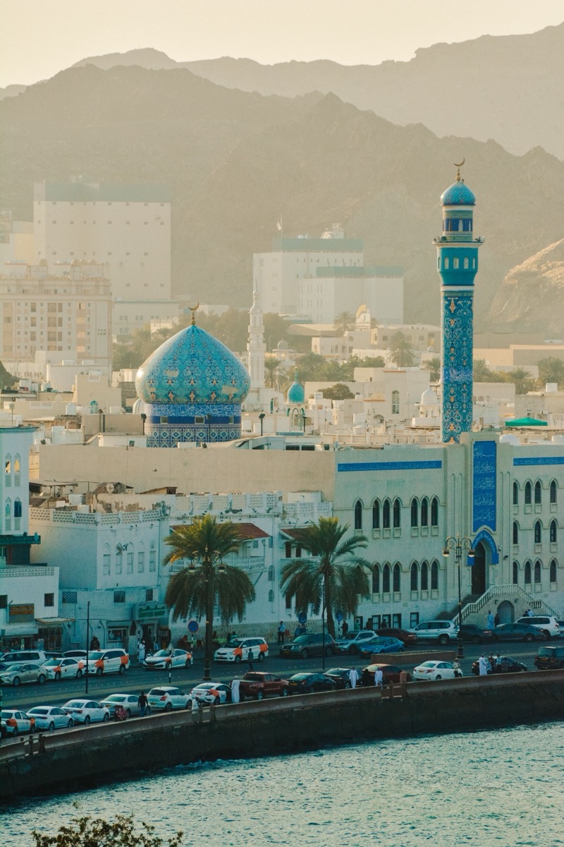 Muttrah Corniche with its blue-domed mosque at sunset
