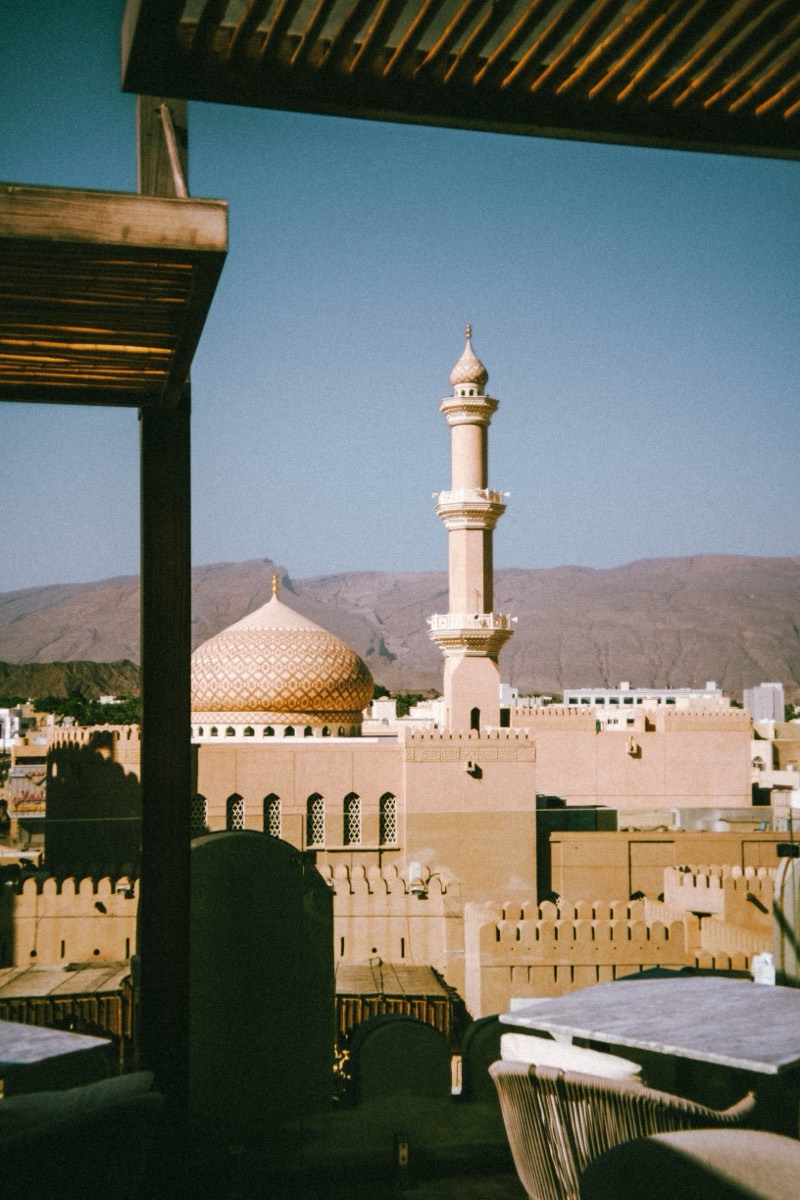 Golden dome and minaret of Nizwa Fort
