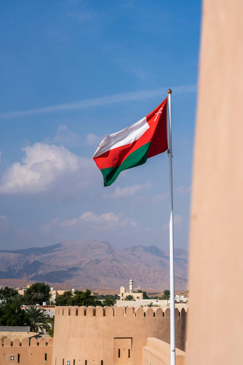 Omani flag flying over Nizwa Fort